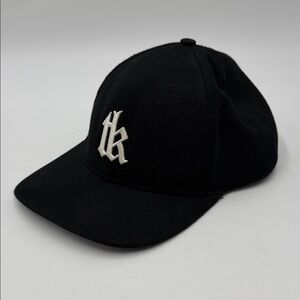 The Kooples logo baseball cap features a black colorway